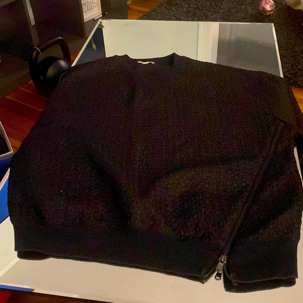 Black long sleeve sweatshirt with zipper in front